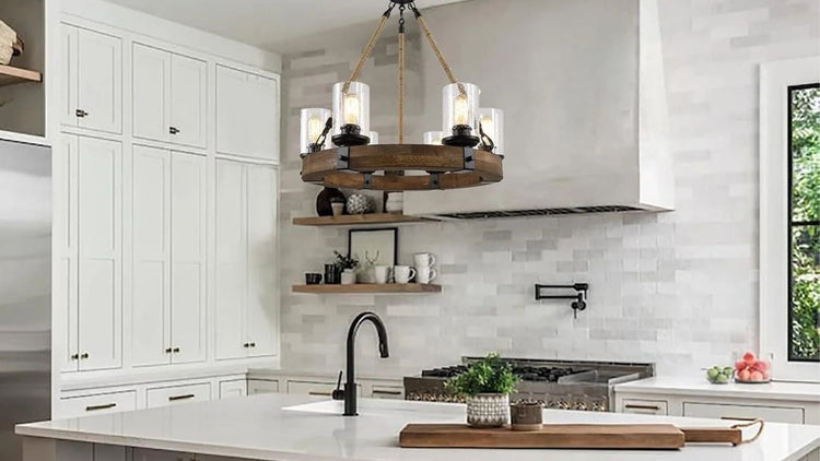 Wooden wagon wheel chandelier over kitchen island